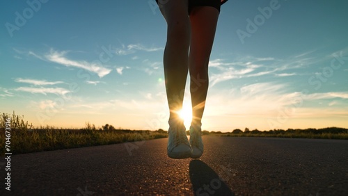 silhouette sports girl running legs along road sunset, man running with effort, sport running endurance training, warming up before training, preparing races, outdoors girl sportswear training, sprint