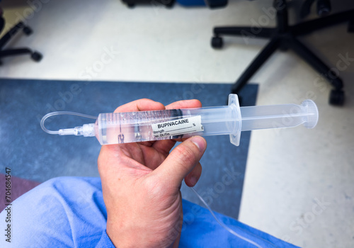 Medical vials, syringes, and needles representing hospital drugs and medications for anesthesia and sedation in healthcare settings photo