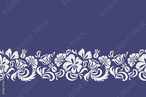 Floral Ikat pattern seamless paisley embroidery on indigo blue background. Silhouette flower motif border ethnic Baroque style abstract vector illustration vintage design for print template.