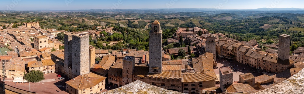 Wide panoramic view over downtown San Gimignano, Torri dei Salvucci and Torre Rognosa in the center, seen from Torre Grosso