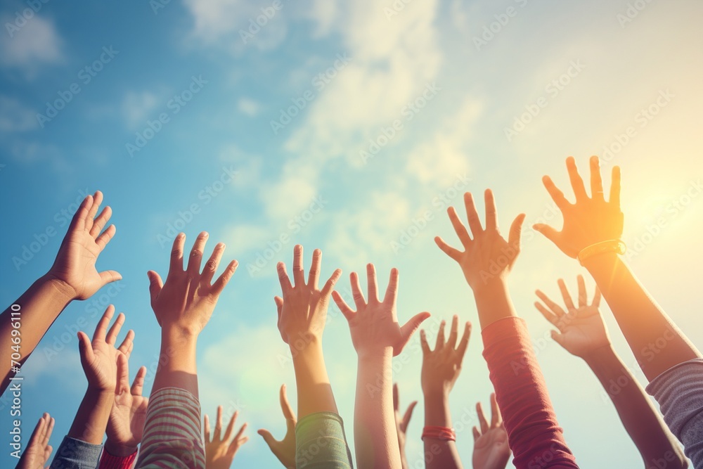 Group of people raising their hands in the air Group of people raising their hands in the air