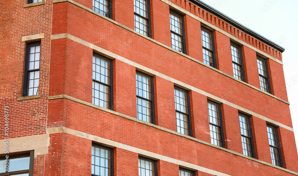 urban brick building, symbolizing stability and growth in commercial real estate urban brick building, symbolizing stability and growth in commercial real estate