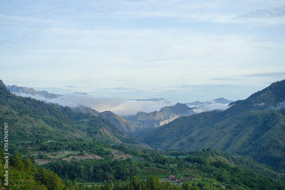 Beautiful panorama of mountains covered with mist