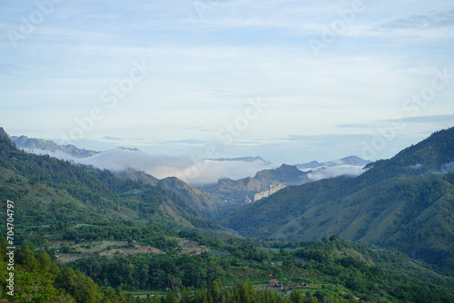 Beautiful panorama of mountains covered with mist © Herwin Bahar