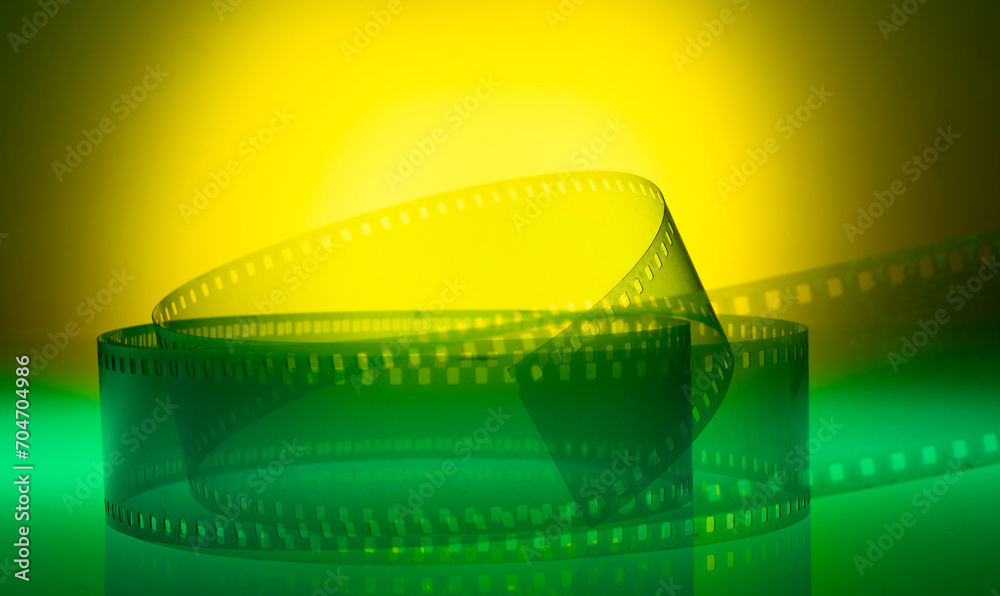 yellow-green background with film strip