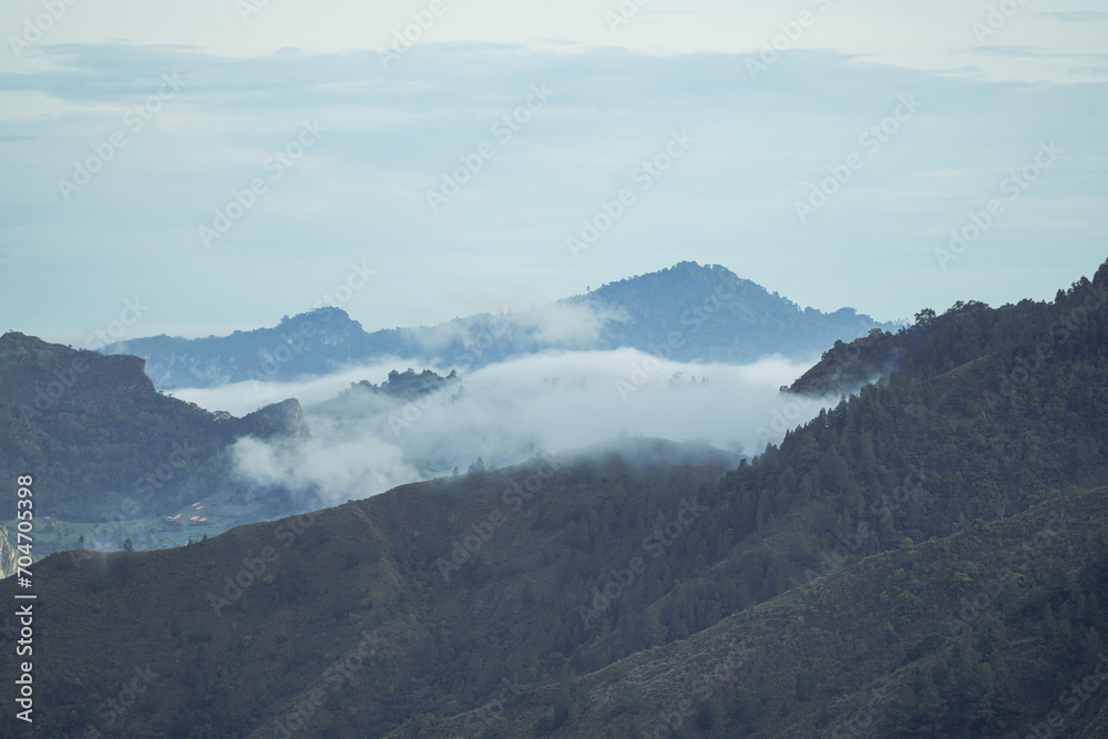 Beautiful panorama of mountains covered with mist Beautiful panorama of mountains covered with mist