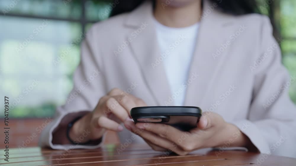 Hand of Asian Female using typing texting mobile phone or chat. Close up of woman hand