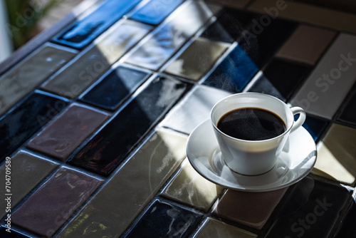 Cup of hot coffee on a table,