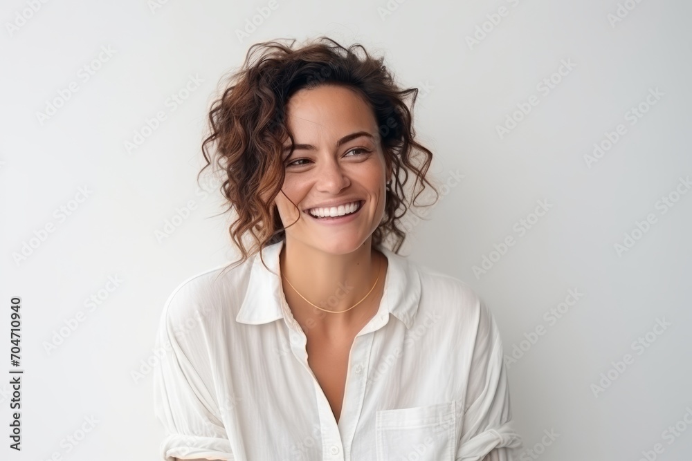 Portrait of a smiling young woman with curly hair against white background Portrait of a smiling young woman with curly hair against white background
