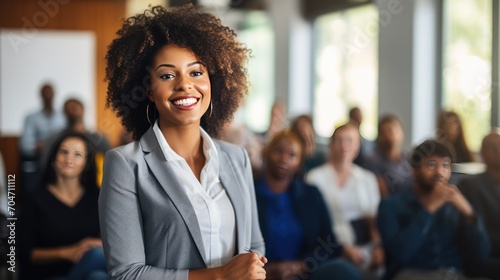 African young business woman in front of a group