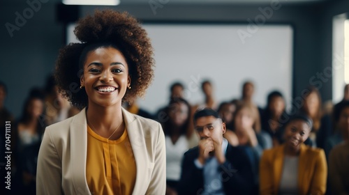 African young business woman in front of a group