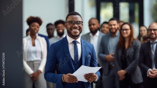 African young business man in front of a group photo