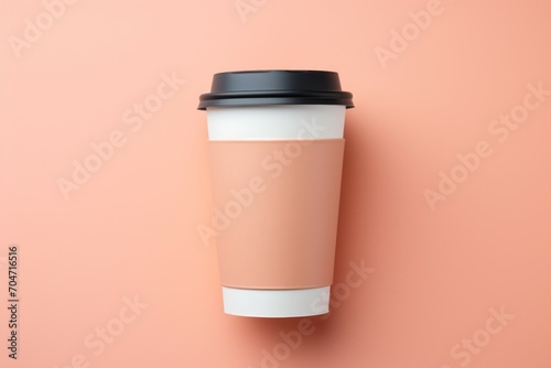 Mockup of a coffee cup in a trendy color. Background with selective focus and copy space