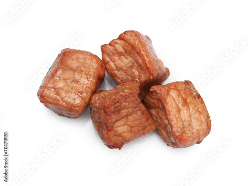 Pieces of delicious cooked beef isolated on white, top view. Tasty goulash