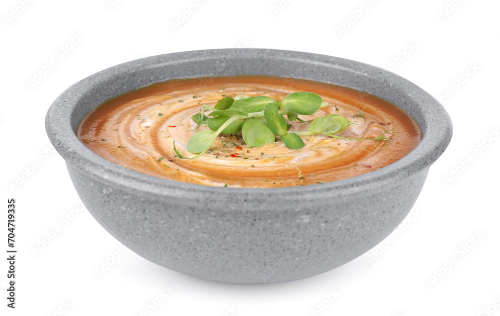 Tasty pumpkin soup with microgreens in bowl isolated on white