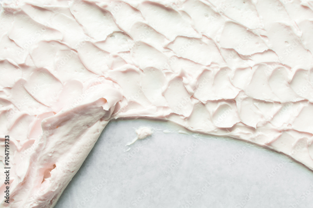 Top view of pink buttercream for decorating cake, silky smooth american buttercream on a marble surface, overhead view of smooth buttercream Top view of pink buttercream for decorating cake, silky smooth american buttercream on a marble surface, overhead view of smooth buttercream
