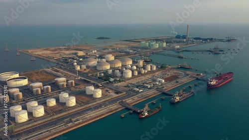 Aerial Top View oil tanker loading dock of business logistic sea going ship, Oil tanker lpg ngv at night / Group Oil tanker to Port of Singapore - Cargo ship import export	