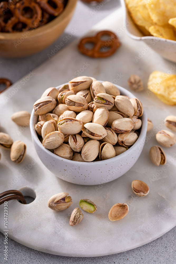 Salted pistachios with other salty snacks usually served with beer Salted pistachios with other salty snacks usually served with beer