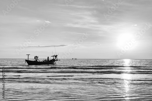 Fishing boat on the sea during sunset