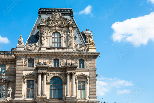 Paris, France - May 20, 2023: view on the Louvre palace and the Tuileries gardens with people