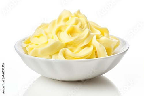 Isolated butter curls in a bowl on a white background