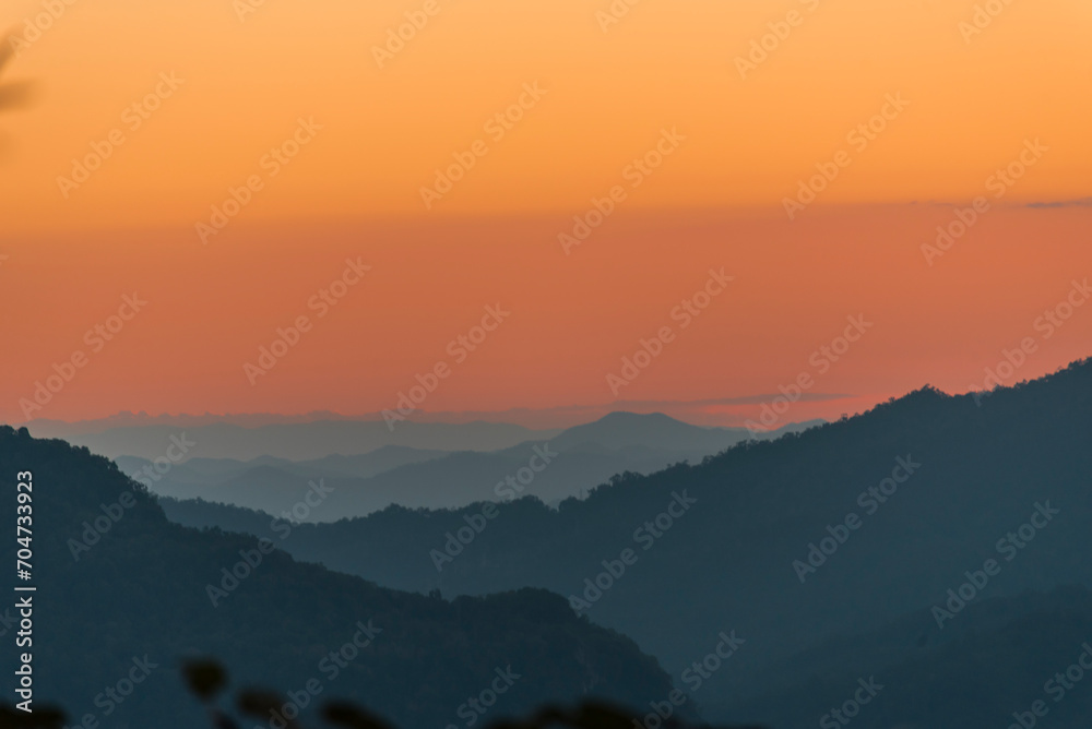 Sunset mountain range beautiful landscape mist, dusk golden time dramatic sky. Beautiful landscape high mountain ridge mist panning panorama scenery dawn dramatic sky. Sunrise landscape mountain peak.
