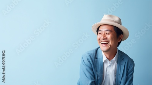 A laughing man wearing a hat