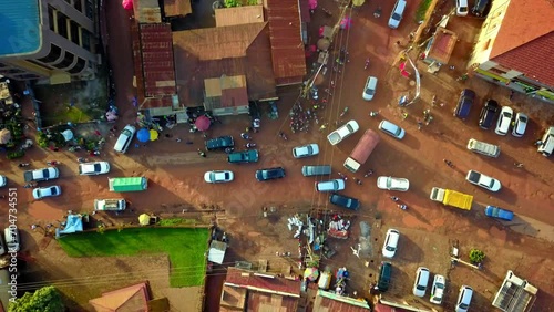 Cars In Traffic Jam On Road Junction In Kampala City, Uganda. aerial topdown shot photo