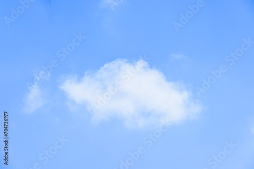 beautiful blue sky and white fluffy single cloud with sunrise in the morning, natural background