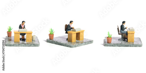 Fototapeta Naklejka Na Ścianę i Meble -  Miniature tiny people toy figure photography. Workspace station layout design concept. A businesswomen seat on his desk, busy, working her job. Isolated on a white background