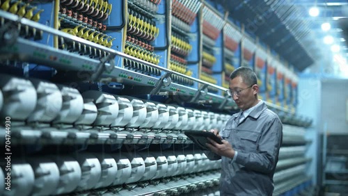people using tablet in chemical fiber plant photo