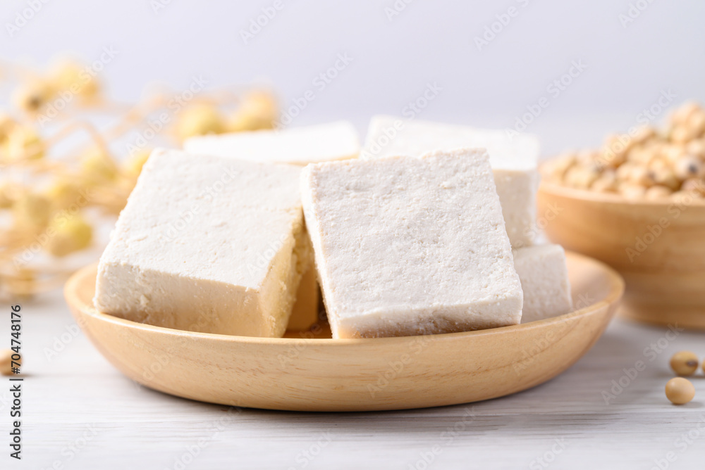 Fresh tofu in wooden bowl, Vegan food ingredient in Asian cuisine, Plant based diet