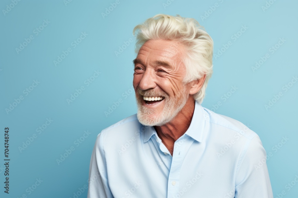 Portrait of a happy senior man on a blue background. Elderly people and health concept. Portrait of a happy senior man on a blue background. Elderly people and health concept.