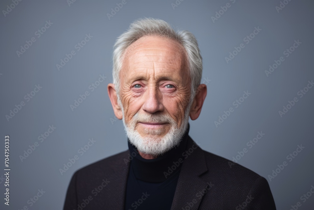 Portrait of a senior man. Isolated on grey background. Portrait of a senior man. Isolated on grey background.