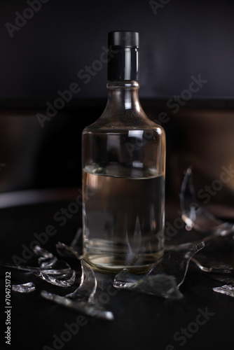 bottle and glass of cognac, ron, vodka