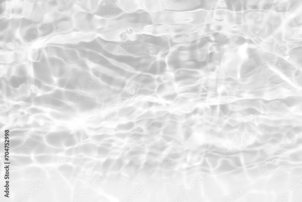 White water with ripples on the surface. Defocus blurred transparent white colored clear calm water surface texture with splashes and bubbles. Water waves with shining pattern texture background. White water with ripples on the surface. Defocus blurred transparent white colored clear calm water surface texture with splashes and bubbles. Water waves with shining pattern texture background.