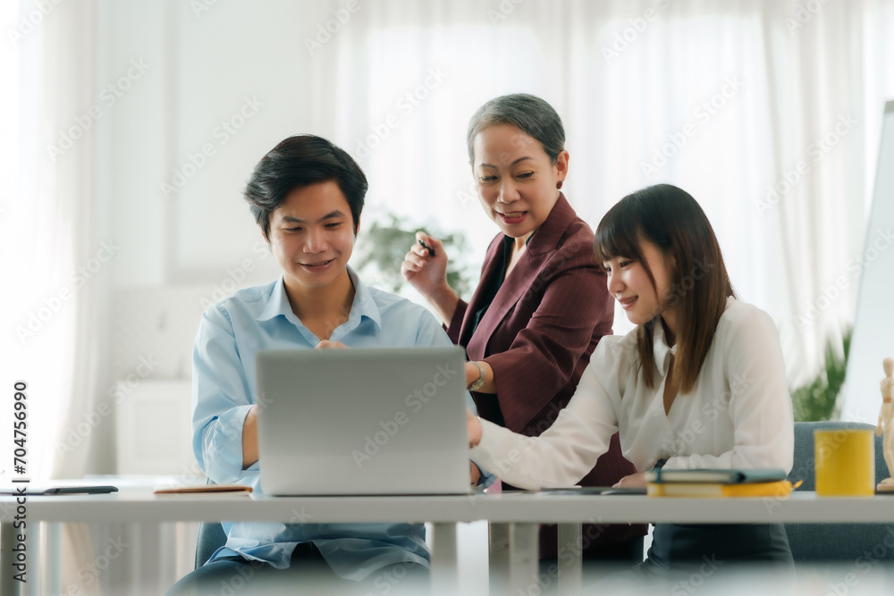 Asian boss or senior employee provide professional help and guidance to intern, practice corporate teamwork communication skill. Asian boss or senior employee provide professional help and guidance to intern, practice corporate teamwork communication skill.
