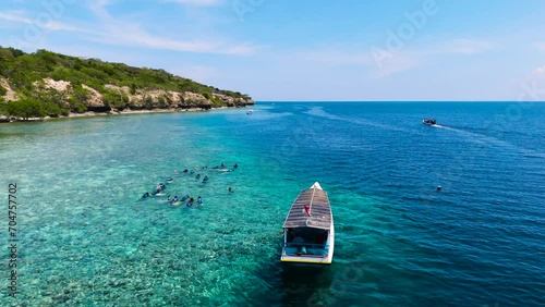 beautiful beach island boat on the blue ocean snorkling sport water activity photo