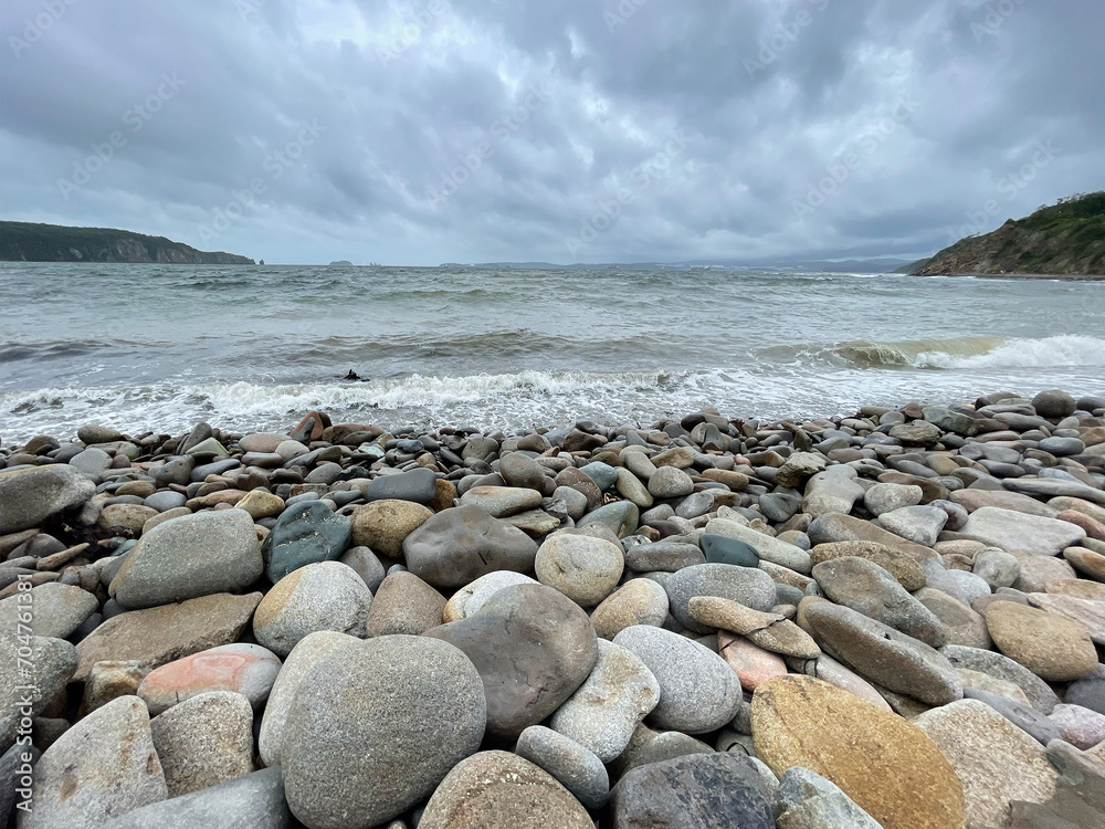 Vladivostok, waves in the Ussuri Bay near Patroclus Bay in cloudy summer weather
