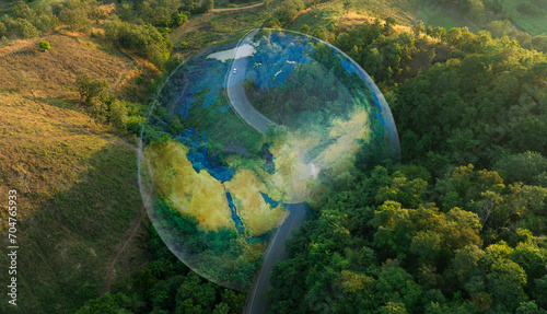 Aerial view of road and green pine forest and soil. electric train concept Use renewable energy and maintain the ecosystem and natural environment as best as possible and help save the planet.