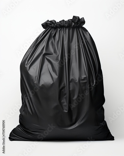 Black garbage bag isolated on white background photo