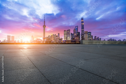 Empty square floor and modern city buildings at sunrise in Shanghai © ABCDstock