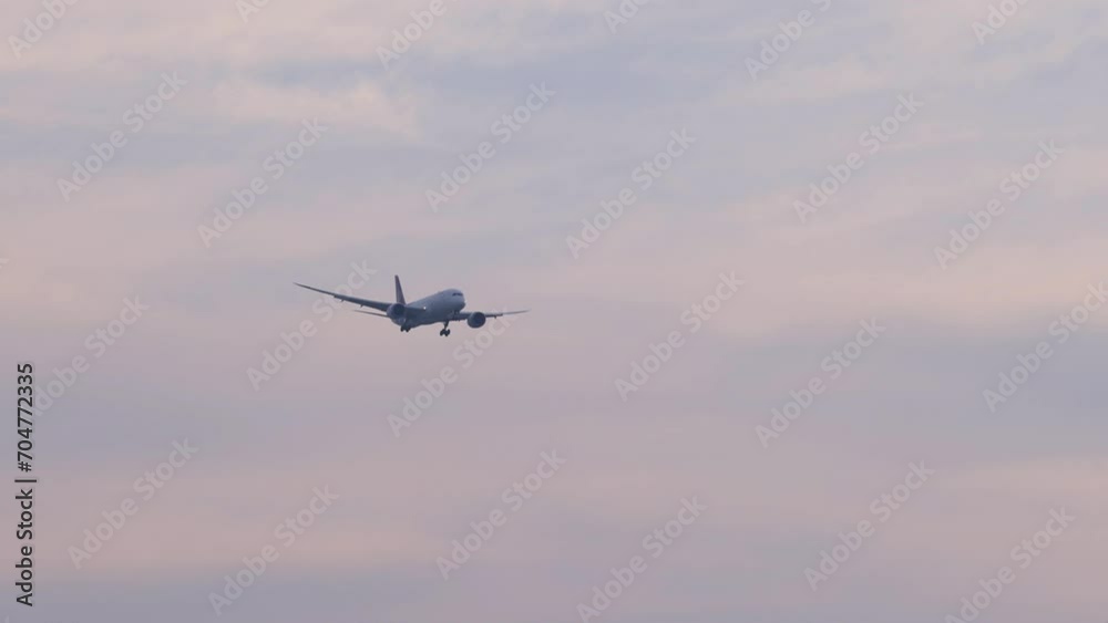 Airplane Descending Against Twilight Sky Airplane Descending Against Twilight Sky