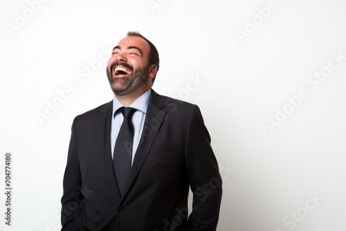 Handsome middle age man shouting with mouth wide open on white background