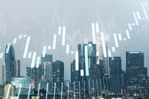 Abstract virtual financial graph hologram on Los Angeles cityscape background  financial and trading concept. Multiexposure