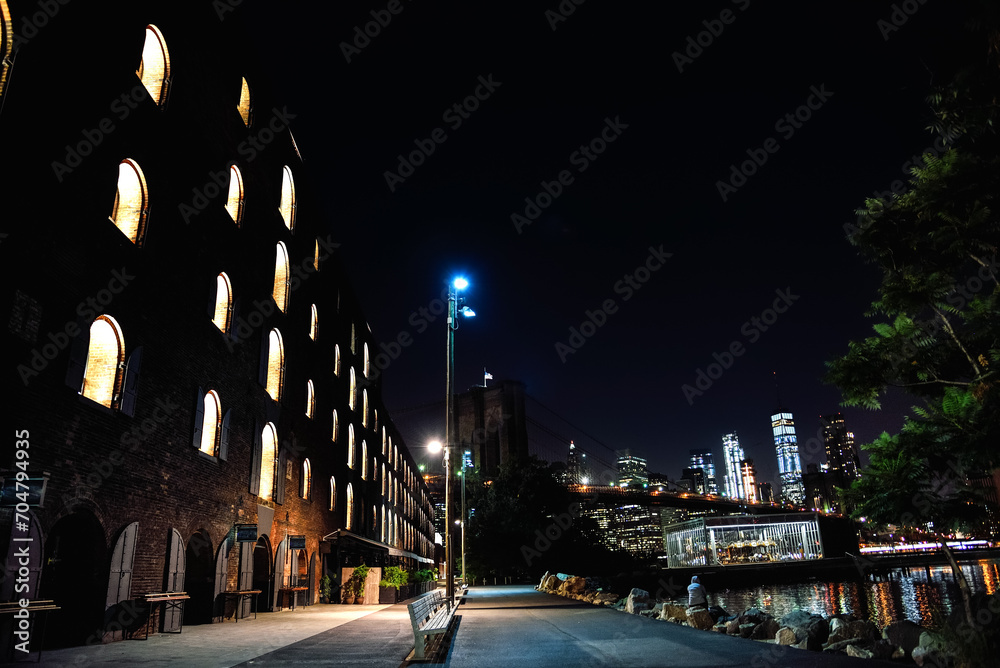 The Brooklyn Bridge and the Facade of the Time Out Market Building at Night - DUMBO, Brooklyn, New York City The Brooklyn Bridge and the Facade of the Time Out Market Building at Night - DUMBO, Brooklyn, New York City