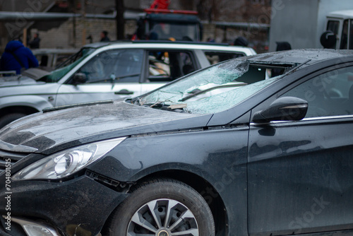 Dnepr, Ukraine – January 6: Russian drones attacked the Dnieper. Burnt and damaged cars in the Dnieper. Utility services clean up the aftermath of the attack on the city. © Sergey