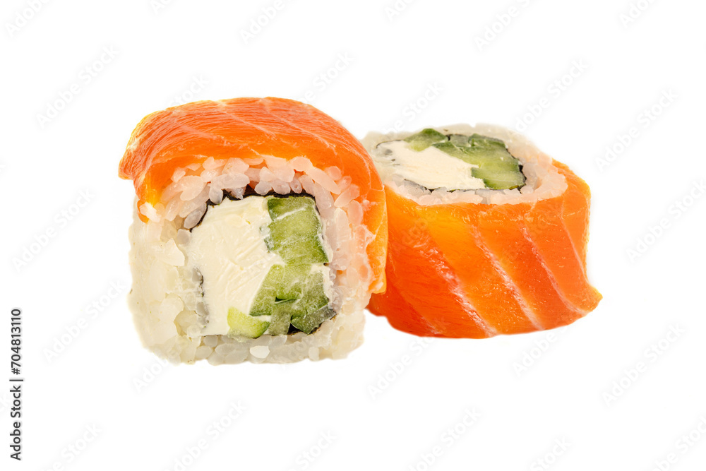 Sushi closeup isolated on white background. Sushi roll with red fish, trout, rice, Philadelphia cheese and cucumber. Japanese restaurant menu. Sushi closeup isolated on white background. Sushi roll with red fish, trout, rice, Philadelphia cheese and cucumber. Japanese restaurant menu.