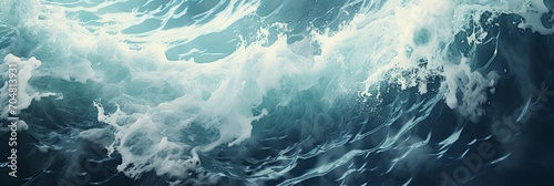 In a close-up view, dynamic ocean waves crash with intensity, creating a mesmerizing display of white foam as the relentless energy of the sea unfolds in vivid detail. © DIMENSIONS