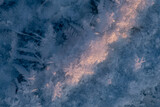 Ice crystals on the ground in winter. Abstract background and texture for design.